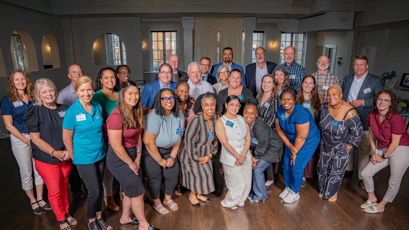 group photo of tpmg employees for beacon award dinner